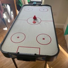 Air hockey table with accessories