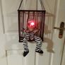 Halloween decorations. Freak in a cage. Image 2