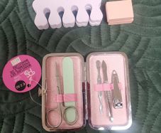 Manicure set, pedicure items, body roller and scrub.