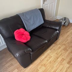 Comfortable brown leather two-sit sofa.
