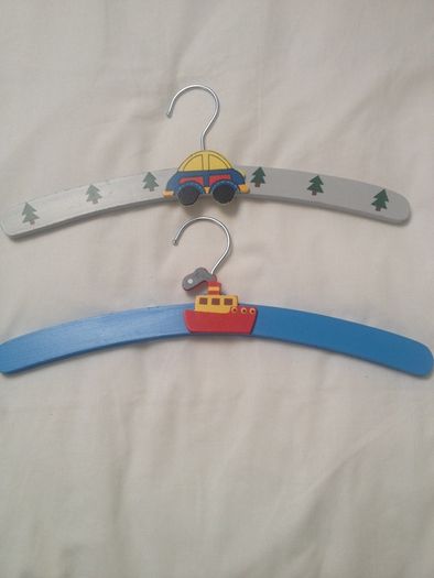 Two wooden hangers painted