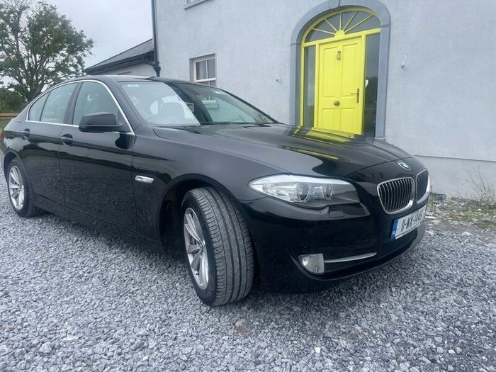 BMW 5 series, black with cream leather interior