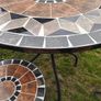 Ceramic table and four chairs. Image 3