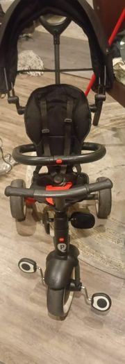 Toddlers trike (red and black) and rain cover