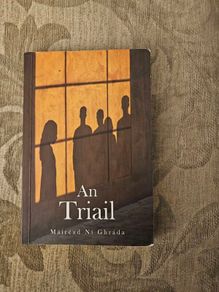 An Triail. By Mairead Ni Ghrada.  Paperback In Good Condition. See Photos For Same.