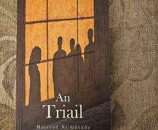 An Triail. By Mairead Ni Ghrada.  Paperback In Good Condition. See Photos For Same.