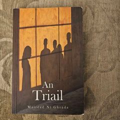 An Triail. By Mairead Ni Ghrada.  Paperback In Good Condition. See Photos For Same.