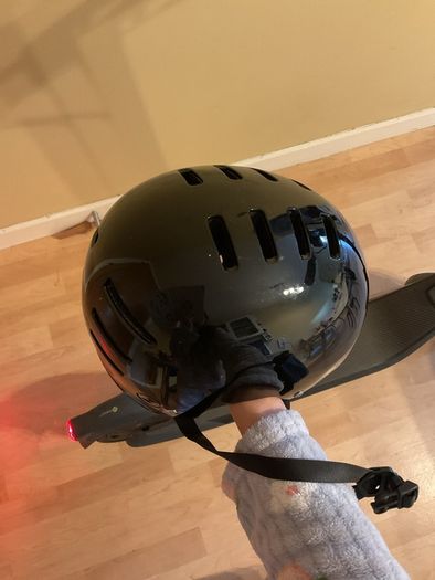 Ninebot E2 scooter with a helmet