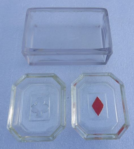 vintage set of molded glass card suit dishes and a matching container, commonly used as bridge ashtrays or nut/trinket dishes.