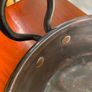 Large heavy antique copper dish with ring handles. Image 3