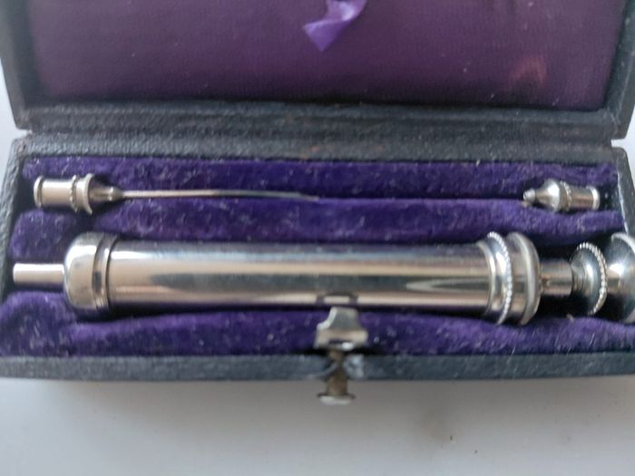 Antique medical syringe in original box