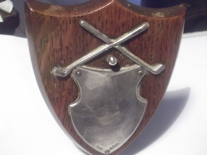 a small antique silver  golf plaque
