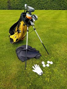 Bag with selection of kids golf clubs