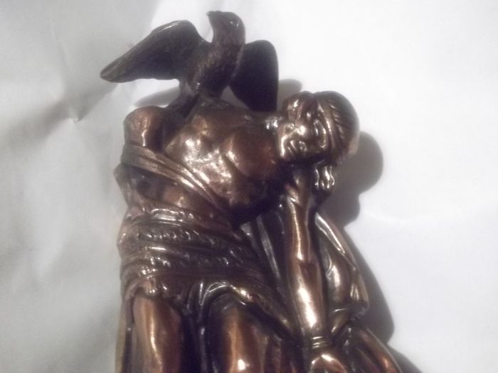 a bronze or metal the death of cuchulainn statue