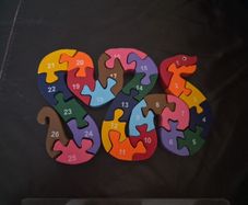 Wooden snake letter/number jigsaw in wooden case