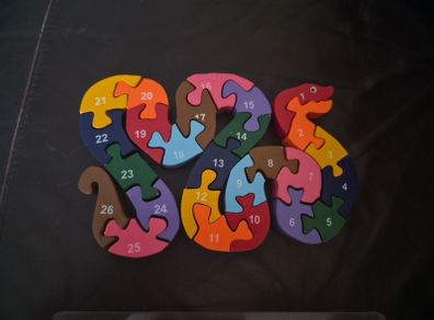 Wooden snake letter/number jigsaw in wooden case