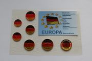 Colorized German euro coins set national tricolour flag