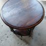 Vintage round nest of tables central round table four pie slice nesting tables tucked underneath Image 2