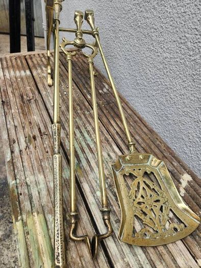antique polished fire dog and irons