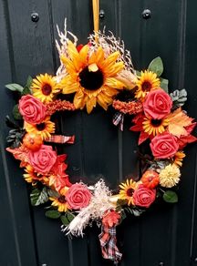 Autumnal door wreath with sunflowers and roses