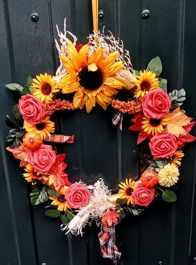 Autumnal door wreath with sunflowers and roses