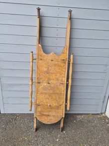 These are vintage wooden snow sleds