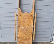 These are vintage wooden snow sleds