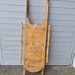 These are vintage wooden snow sleds