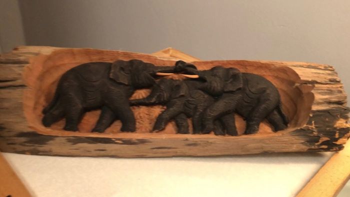 Hand carved wood.
