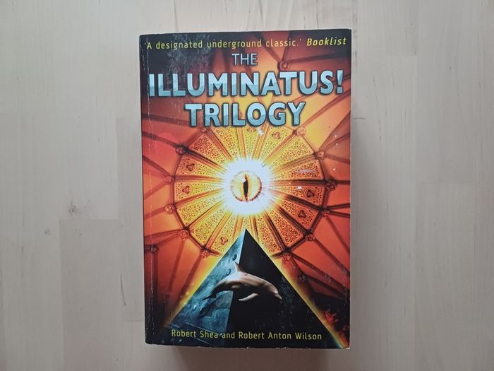 The Illuminatus Trilogy by Robert Anton Wilson (Science Fiction Conspiracy Paperback 1998)