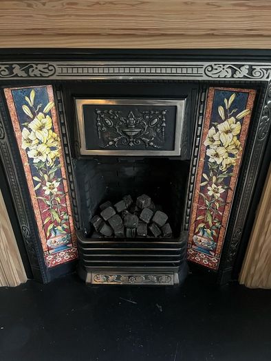 Wooden Fireplace with Tiled Cast Iron Surround