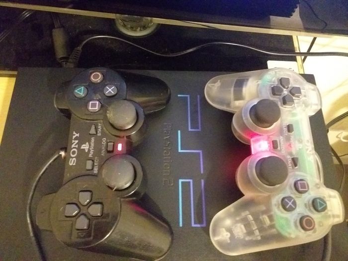 Sony PlayStation 2 console with two controllers