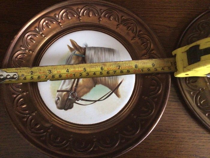 A pair of 10 inch copper wall hanging horses head plaques with hangers