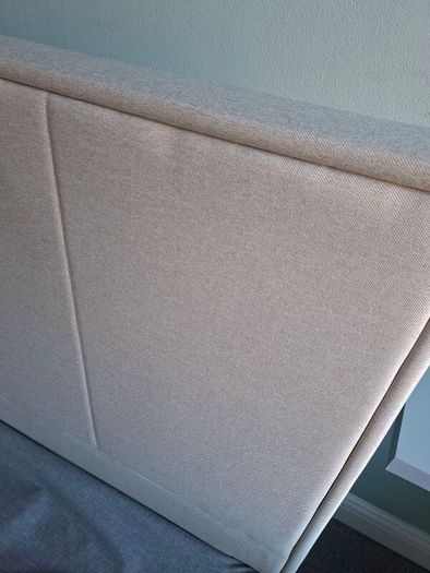 Standard double bed with cream headboard