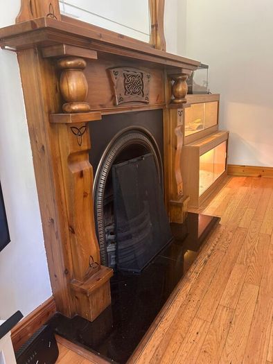 Fireplace mantle with mirror