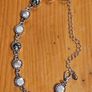 This matching silver-tone crystal necklace and bracelet set features alternating clear and black round stations with textured bezels.  SEE PHOTOS FOR SAME. Image 7