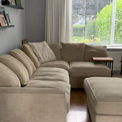 Corner sofa with footstool