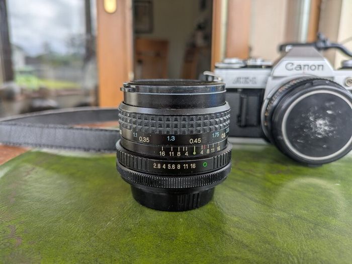 Canon AE-1 + FD 50mm f/1.8 + Tokina 28mm f/2.8