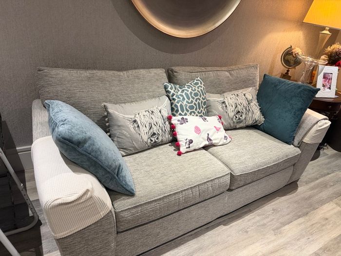 Grey fabric two-seater sofa