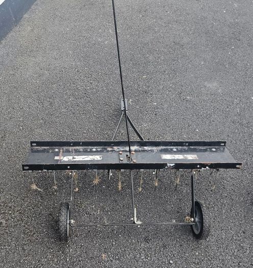 Tow behind lawn dethatcher