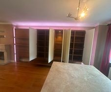 wall unit, made to fit a sitting room, in mint condition, fit with lights and glass doors, need gone asap