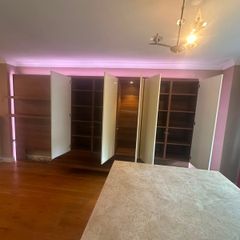 wall unit, made to fit a sitting room, in mint condition, fit with lights and glass doors, need gone asap