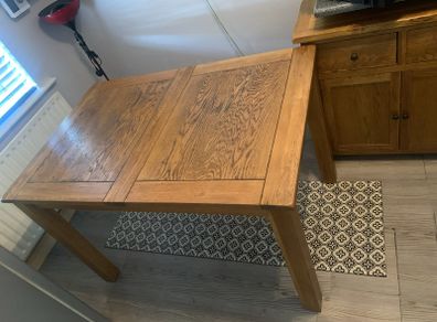 free table with extension piece and four chairs