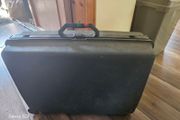 Vintage hardshell suitcase possibly Samsonite durable storage