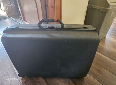 Vintage hardshell suitcase possibly Samsonite durable storage
