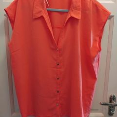 orange short sleve blouse 14 to 16 but big fit size 18
