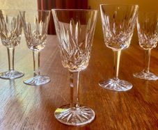 Four Waterford Crystal Lismore Sherry Glasses, One Lismore Small Wine Glass, 1970s.