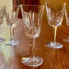 Four Waterford Crystal Lismore Sherry Glasses, One Lismore Small Wine Glass, 1970s.