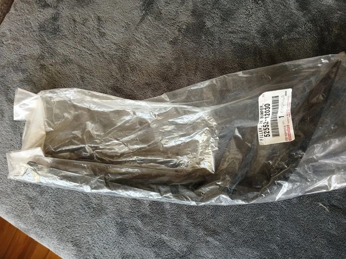 Genuine Toyota Corolla Ae10, 92-97 Part 52552-12030 (filler, Rear Bumper, Rh)