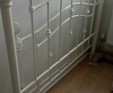 White metal double bed with mattress